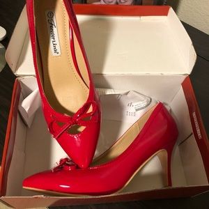 Red patent leather pumps